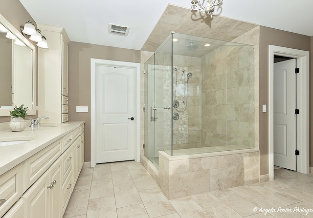 75 N Lake Ave, Third Lake, IL 60030 - full bathroom featuring a shower stall, baseboards, double vanity, and marble finish floors