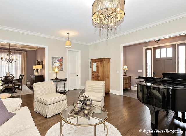 75 N Lake Ave, Third Lake, IL 60030 - living room featuring a chandelier, plenty of natural light, dark wood-type flooring, ornamental molding, and baseboards
