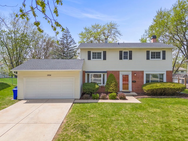 1984 Nottingham Ln, Wheaton, IL 60189 - view of front of home featuring an attached garage, concrete driveway, a front lawn, a chimney, and brick siding