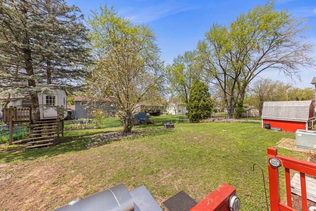 1984 Nottingham Ln, Wheaton, IL 60189 - view of yard featuring a wooden deck, an outdoor structure, stairs, and a storage unit