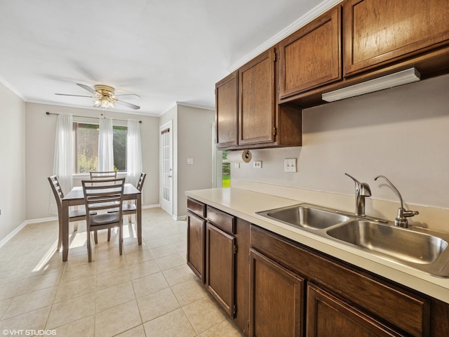 751 Sterling Ct Unit D1, Bartlett, IL 60103 - kitchen with ornamental molding, light countertops, ceiling fan, and light tile patterned floors