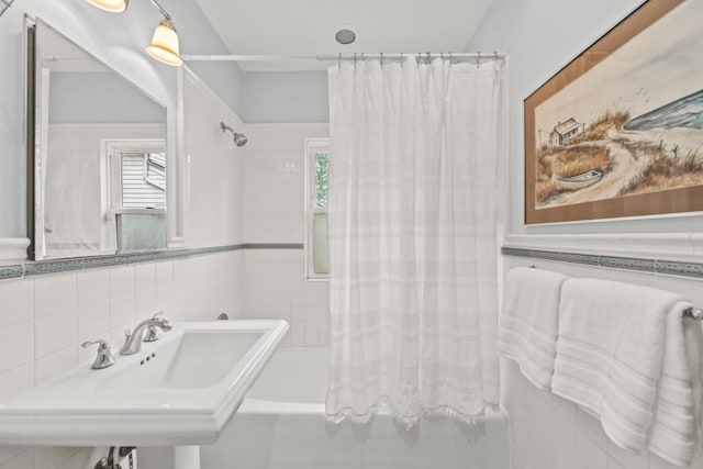 2749 Reese Ave, Evanston, IL 60201 - full bathroom featuring a sink, plenty of natural light, shower / bath combination with curtain, and tile walls