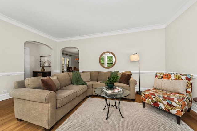2749 Reese Ave, Evanston, IL 60201 - living area featuring arched walkways, crown molding, wood finished floors, and baseboards