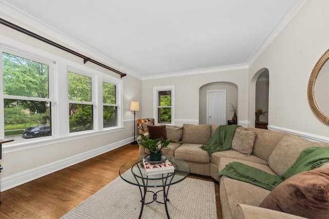 2749 Reese Ave, Evanston, IL 60201 - living area featuring arched walkways, crown molding, baseboards, and wood finished floors