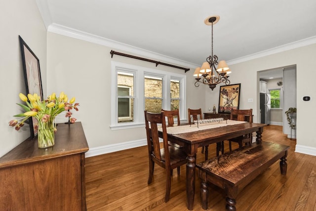 2749 Reese Ave, Evanston, IL 60201 - dining space featuring wood finished floors, crown molding, a chandelier, and baseboards