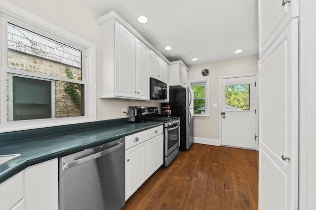 2749 Reese Ave, Evanston, IL 60201 - kitchen featuring appliances with stainless steel finishes, dark countertops, white cabinetry, dark wood-style flooring, and baseboards