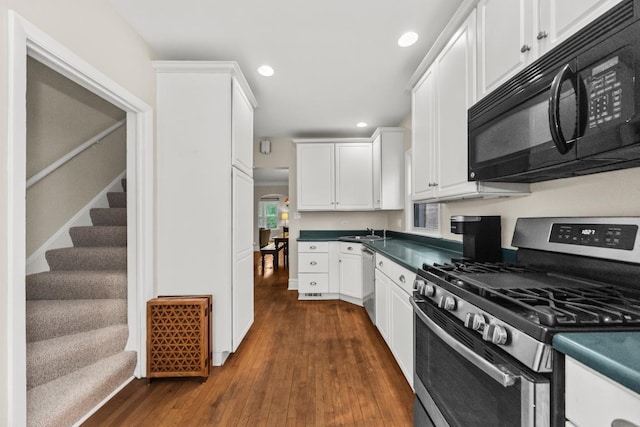 2749 Reese Ave, Evanston, IL 60201 - kitchen with stainless steel appliances, a sink, dark countertops, white cabinetry, and recessed lighting