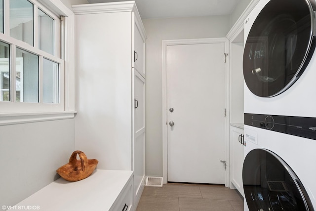 816 S Hamlin Ave, Park Ridge, IL 60068 - laundry area featuring stacked washer / drying machine and cabinet space