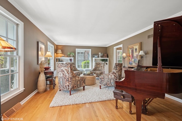 816 S Hamlin Ave, Park Ridge, IL 60068 - living area featuring plenty of natural light, wood finished floors, crown molding, and baseboards
