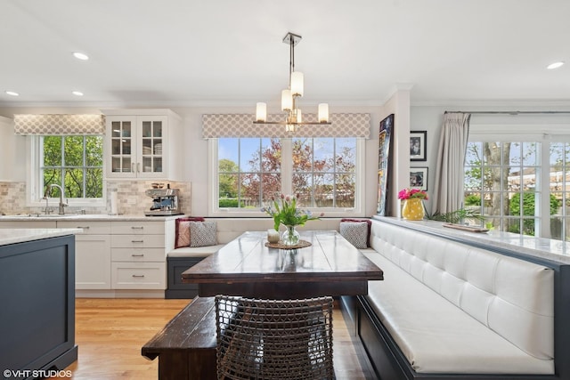 816 S Hamlin Ave, Park Ridge, IL 60068 - dining room with a chandelier, plenty of natural light, ornamental molding, light wood finished floors, and recessed lighting