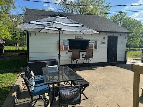 1415 Woodridge Dr, Danville, IL 61832 - view of patio featuring outdoor dining space and fence