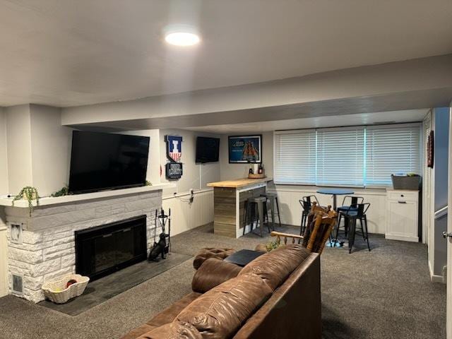 1415 Woodridge Dr, Danville, IL 61832 - carpeted living room featuring a stone fireplace