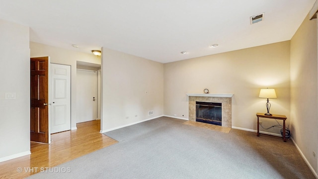 500 Shallow Cove Rd, Lake Zurich, IL 60047 - unfurnished living room with carpet, baseboards, a fireplace, and wood finished floors