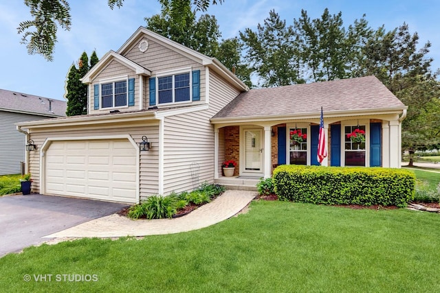 500 Shallow Cove Rd, Lake Zurich, IL 60047 - view of front of home featuring a front yard, driveway, a garage, covered porch, and a shingled roof
