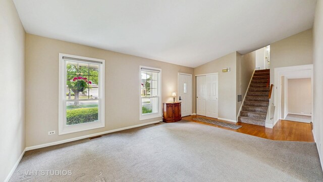 500 Shallow Cove Rd, Lake Zurich, IL 60047 - foyer entrance featuring carpet, stairs, baseboards, and lofted ceiling
