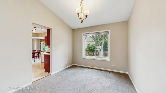 500 Shallow Cove Rd, Lake Zurich, IL 60047 - unfurnished living room featuring light carpet, baseboards, lofted ceiling, and a chandelier