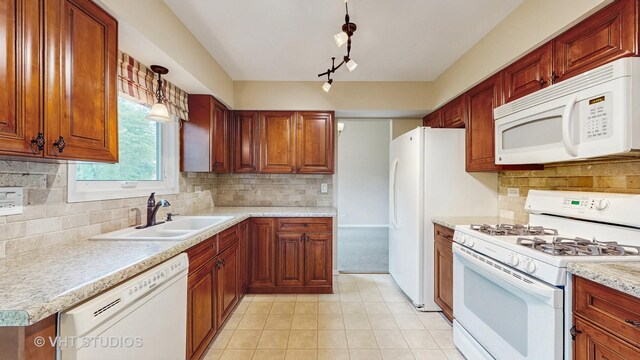 500 Shallow Cove Rd, Lake Zurich, IL 60047 - kitchen featuring white appliances, a sink, light countertops, decorative backsplash, and light tile patterned floors