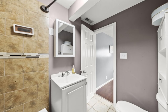 2002 Grove Ave, North Chicago, IL 60064 - bathroom featuring toilet, vanity, and tile patterned flooring