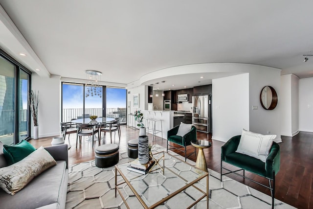 225 N Columbus Dr Unit 6305, Chicago, IL 60601 - living room with light wood-type flooring, floor to ceiling windows, arched walkways, recessed lighting, and a chandelier