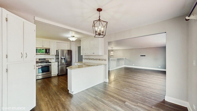 2525 Ridge Rd, Aurora, IL 60504 - kitchen with stainless steel appliances, a peninsula, dark wood-type flooring, white cabinets, and baseboards