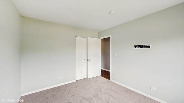 2525 Ridge Rd, Aurora, IL 60504 - unfurnished bedroom featuring carpet, baseboards, and a closet