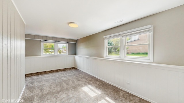 2525 Ridge Rd, Aurora, IL 60504 - carpeted spare room with a wainscoted wall
