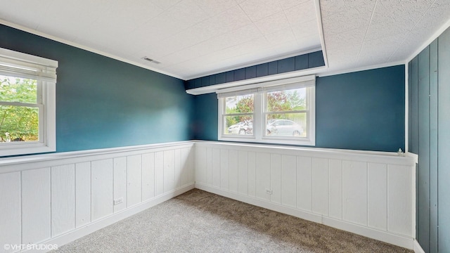 2525 Ridge Rd, Aurora, IL 60504 - unfurnished room featuring healthy amount of natural light, wainscoting, and carpet floors
