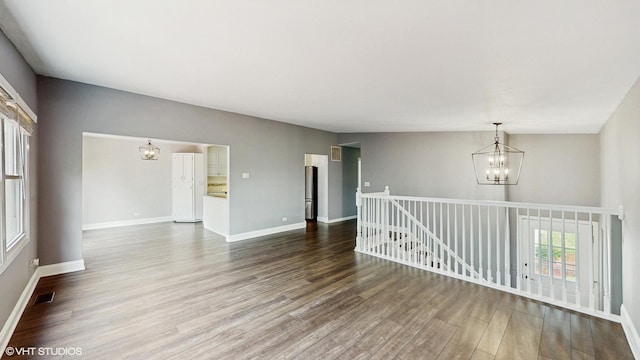 2525 Ridge Rd, Aurora, IL 60504 - unfurnished room with a chandelier, wood finished floors, and baseboards