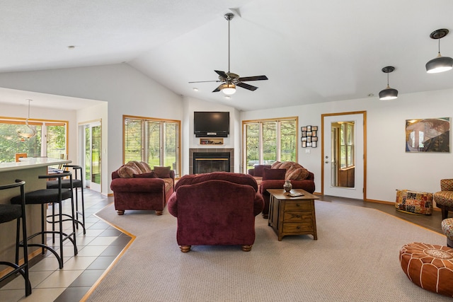 3262 Greenwood Dr, Dewey, IL 61840 - tiled living room featuring vaulted ceiling, a ceiling fan, and a fireplace
