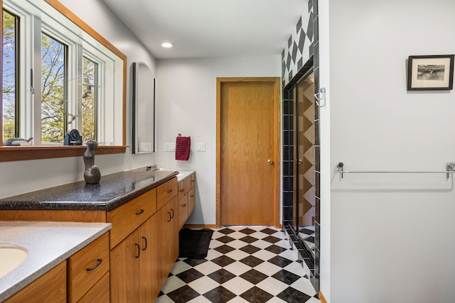 3262 Greenwood Dr, Dewey, IL 61840 - bathroom featuring tile patterned floors, double vanity, a stall shower, recessed lighting, and baseboards