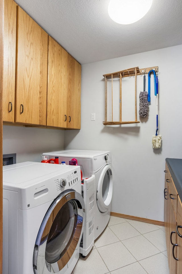 3262 Greenwood Dr, Dewey, IL 61840 - laundry room with cabinet space, independent washer and dryer, baseboards, and a textured ceiling