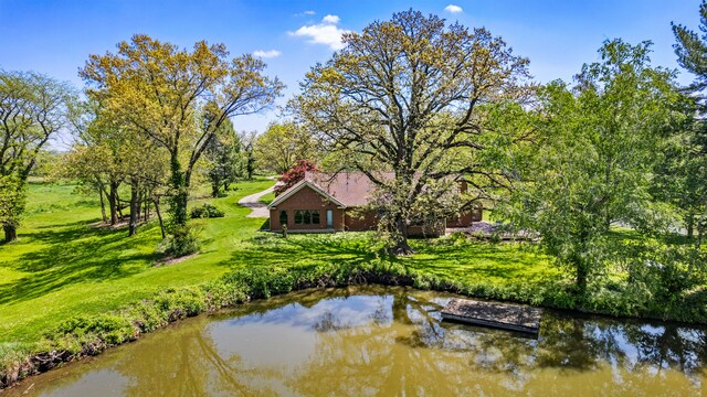 3262 Greenwood Dr, Dewey, IL 61840 - rear view of house featuring a lawn and a water view