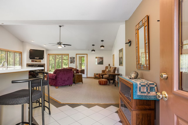 3262 Greenwood Dr, Dewey, IL 61840 - living room with vaulted ceiling, light colored carpet, ceiling fan, and light tile patterned floors