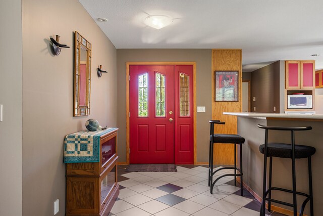 3262 Greenwood Dr, Dewey, IL 61840 - foyer featuring baseboards and light tile patterned floors