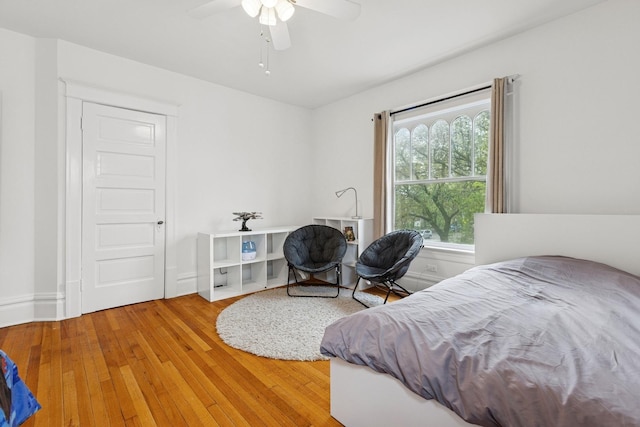 bedroom featuring wood finished floors and a ceiling fan