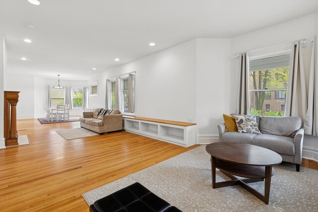 living area featuring wood finished floors and recessed lighting