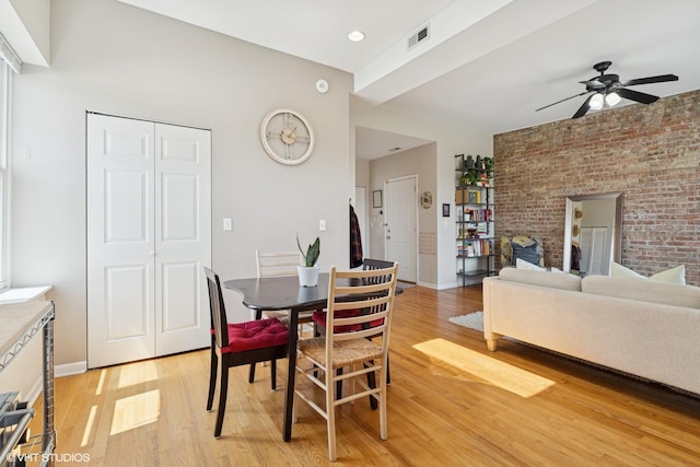 4817 N Fairfield Ave Unit 3, Chicago, IL 60625 - dining area with light wood finished floors, a ceiling fan, brick wall, and baseboards