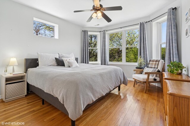 4817 N Fairfield Ave Unit 3, Chicago, IL 60625 - bedroom with multiple windows, light wood-style floors, and ceiling fan