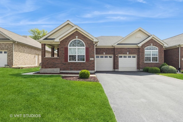 921 Eineke Blvd, Algonquin, IL 60102 - single story home featuring asphalt driveway, an attached garage, a front lawn, and brick siding