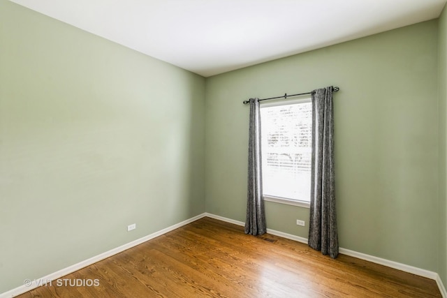 921 Eineke Blvd, Algonquin, IL 60102 - spare room with baseboards and wood finished floors
