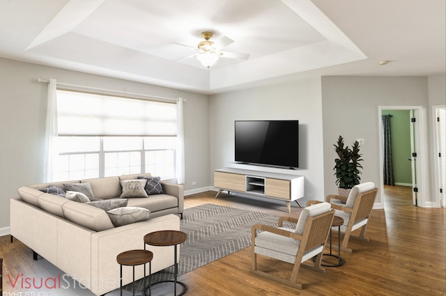 921 Eineke Blvd, Algonquin, IL 60102 - living room featuring a raised ceiling, a ceiling fan, wood finished floors, and baseboards
