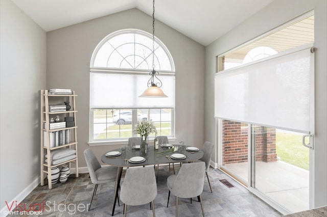 921 Eineke Blvd, Algonquin, IL 60102 - dining space featuring stone finish flooring, lofted ceiling, and baseboards