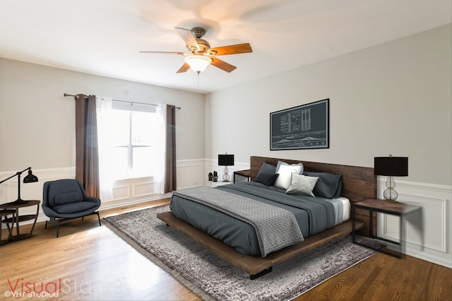921 Eineke Blvd, Algonquin, IL 60102 - bedroom with a wainscoted wall, wood finished floors, ceiling fan, and a decorative wall