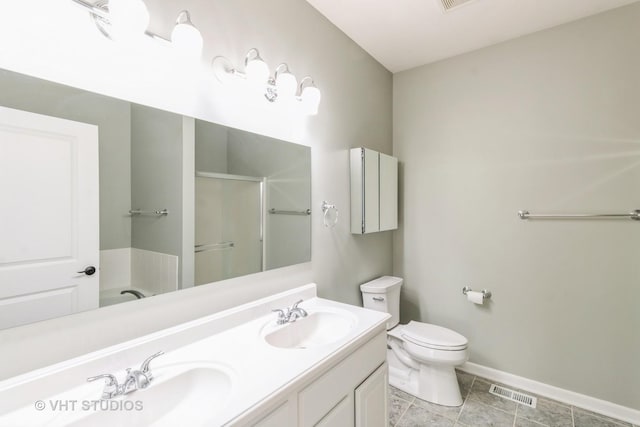 921 Eineke Blvd, Algonquin, IL 60102 - bathroom featuring a stall shower, toilet, baseboards, double vanity, and tile patterned floors