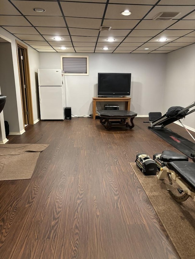 3991 Whispering Trails Dr, Hoffman Estates, IL 60192 - exercise area with wood finished floors, a paneled ceiling, and baseboards