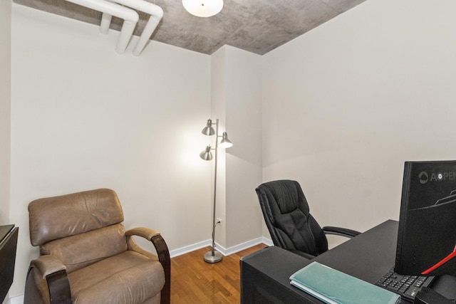 office featuring wood finished floors and baseboards