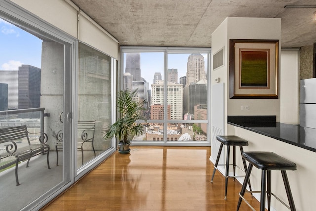 sunroom / solarium with a view of skyline