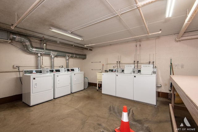 7930 Woodglen Ln Unit 204, Downers Grove, IL 60516 - community laundry room featuring separate washer and dryer and concrete block wall