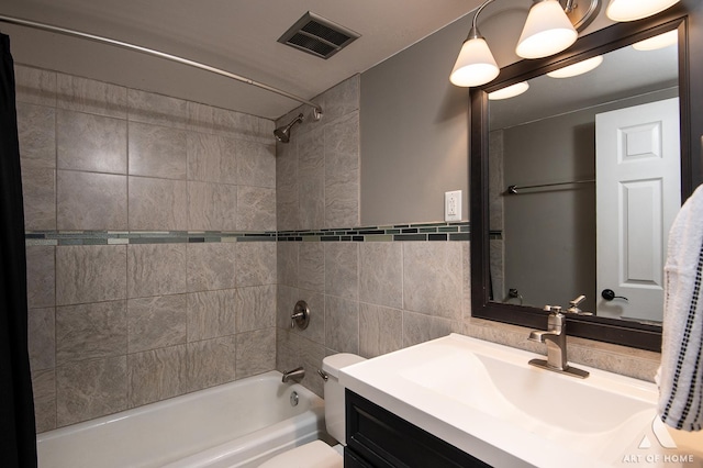7930 Woodglen Ln Unit 204, Downers Grove, IL 60516 - bathroom featuring tile walls,  shower combination, vanity, and toilet