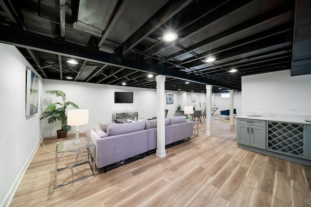 220 E Washington St, Des Plaines, IL 60016 - living area featuring light wood finished floors, bar, and baseboards